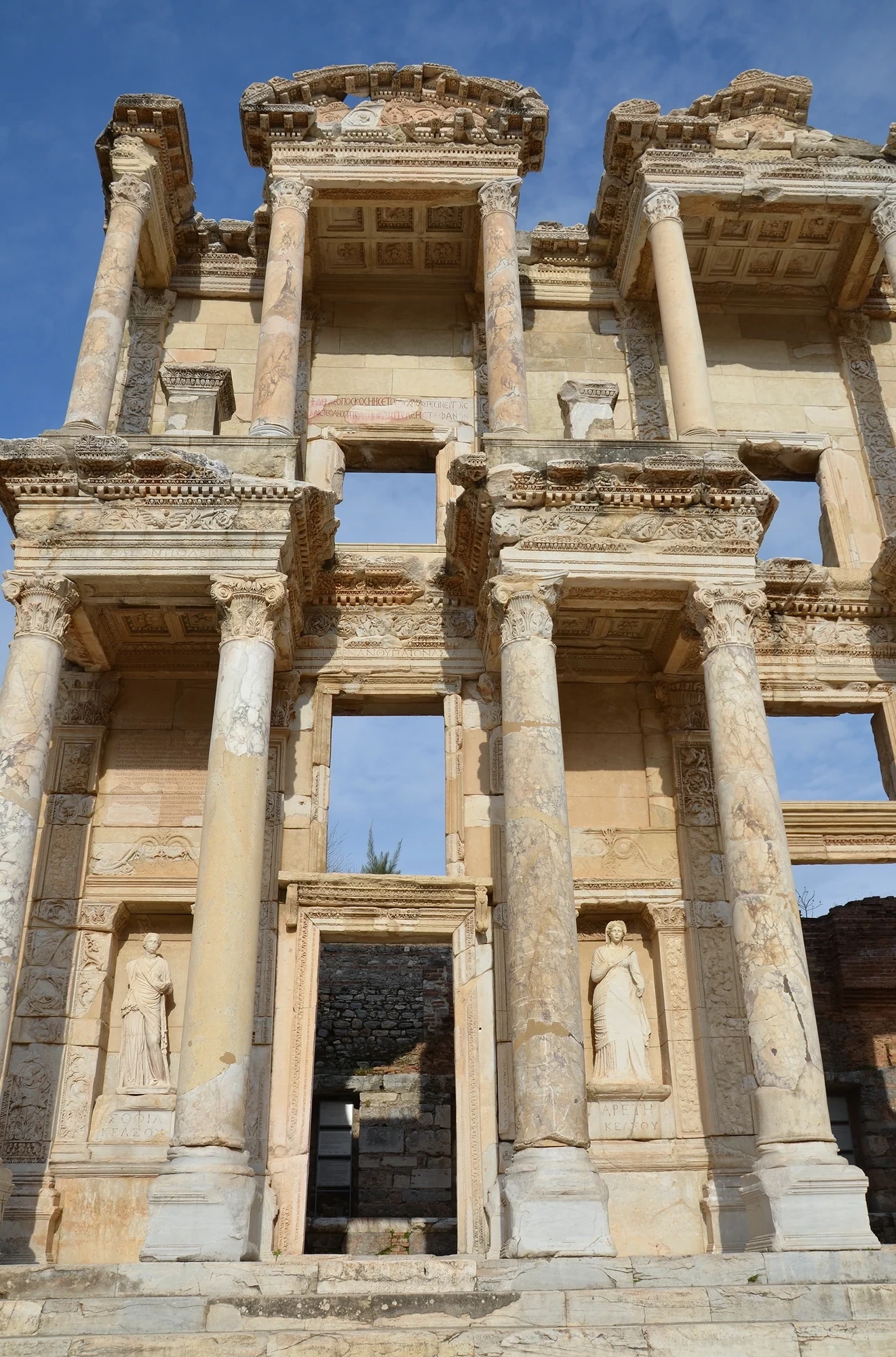 The Library of Celsus at Ephesus, c. A.D. 110 &mdash; the classical Roman library facade with statues of Sophia, Episteme, Ennoia, and Arete