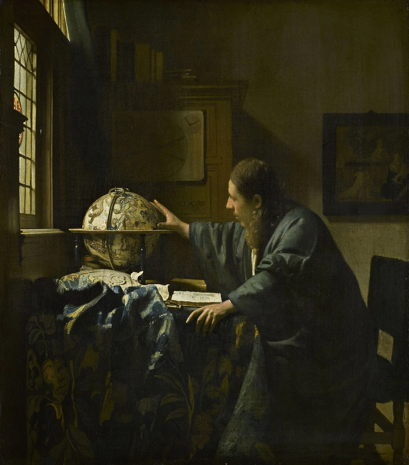 The Astronomer by Johannes Vermeer, 1668 &mdash; a scholar at his desk with a celestial globe and open book of star charts